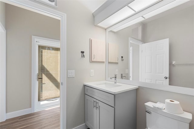 11332 Rivers Bluff Cir, Lakewood Ranch, FL 34202 - half bath featuring toilet, baseboards, wood finished floors, and vanity