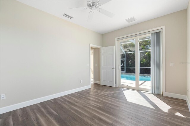 11332 Rivers Bluff Cir, Lakewood Ranch, FL 34202 - spare room featuring baseboards, dark wood finished floors, and a ceiling fan