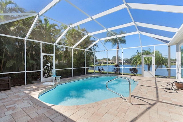 view of pool featuring a lanai, a patio area, and a water view