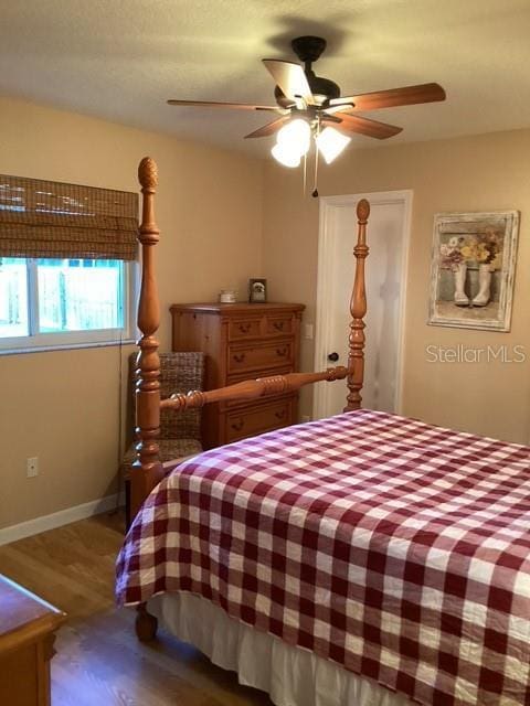 4601 Ulster Ave, North Port, FL 34287 - bedroom featuring baseboards, a ceiling fan, and wood finished floors