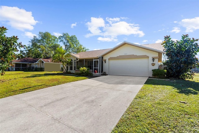 ranch-style home with a front lawn and a garage