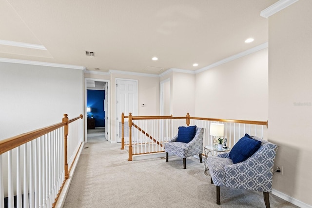 living area featuring crown molding and light colored carpet