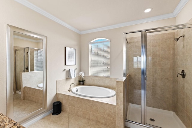 bathroom featuring tile patterned floors, ornamental molding, and independent shower and bath