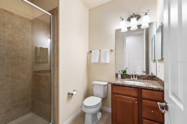 bathroom with walk in shower, vanity, and toilet