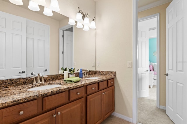 bathroom with crown molding and vanity