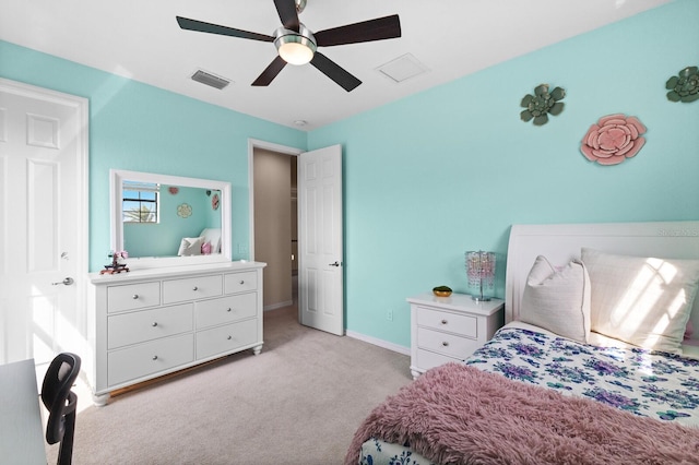 bedroom with ceiling fan and light carpet