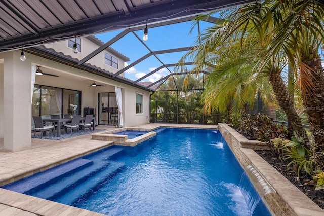 view of pool with pool water feature, a patio area, a lanai, an in ground hot tub, and ceiling fan