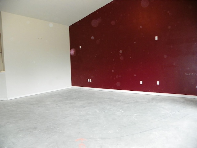 empty room featuring concrete flooring