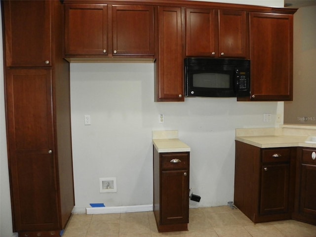 kitchen featuring light tile patterned flooring