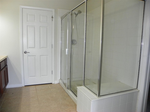 bathroom featuring vanity, tile patterned floors, and an enclosed shower