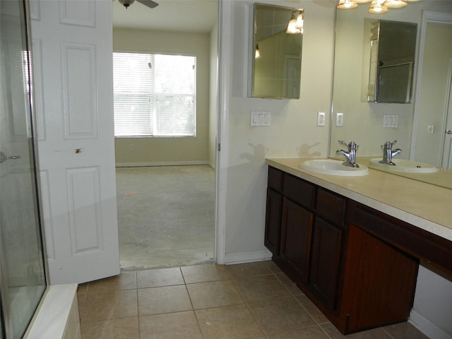 bathroom with vanity, ceiling fan, tile patterned floors, and walk in shower