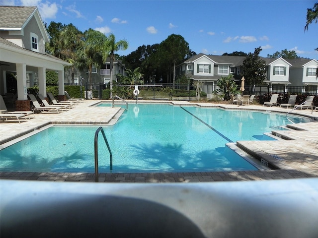 view of swimming pool featuring a patio area