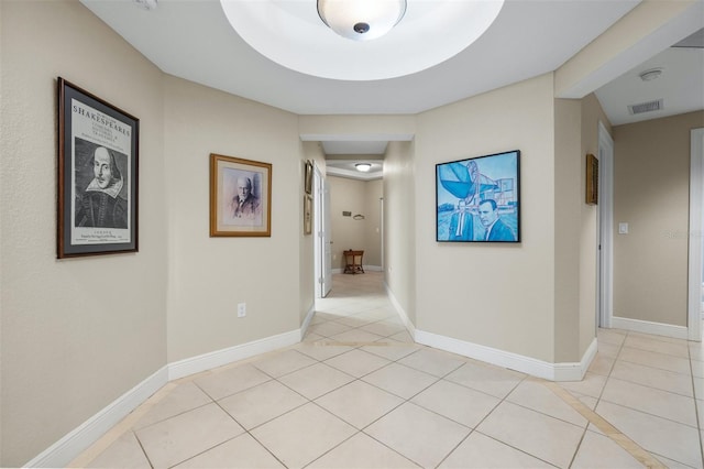 corridor with light tile patterned flooring