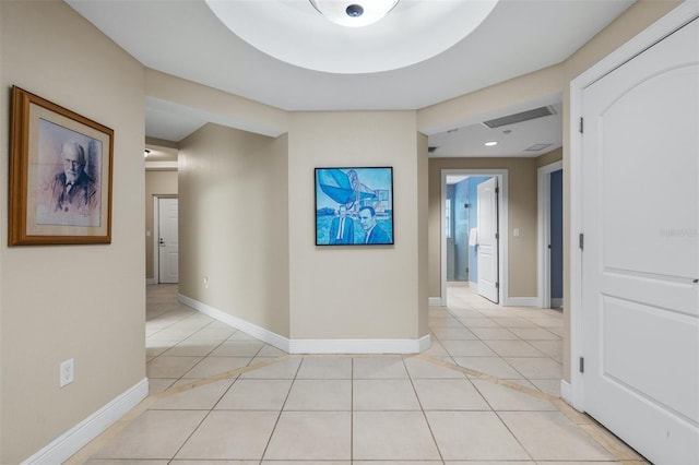 hallway with light tile patterned floors