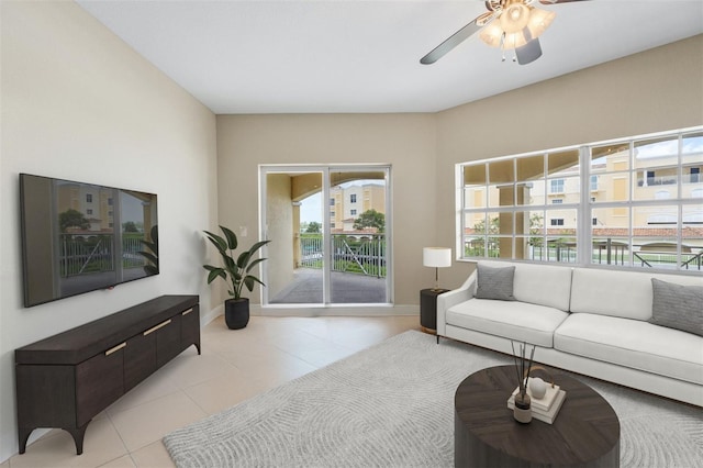 living room featuring light tile patterned floors and ceiling fan