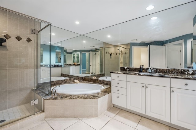 bathroom with vanity, tile patterned floors, and separate shower and tub