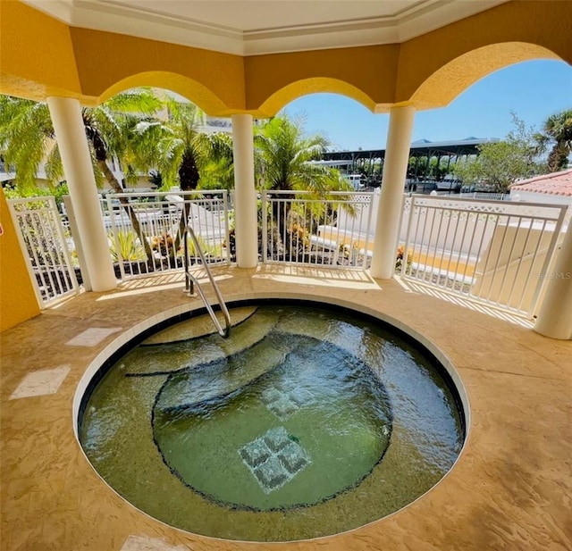 view of pool featuring a hot tub