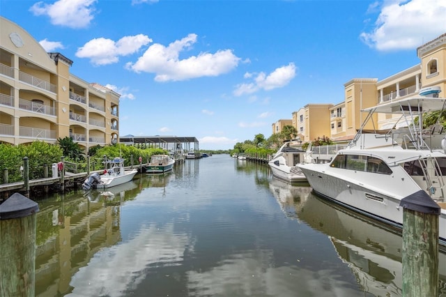 dock area featuring a water view and a balcony