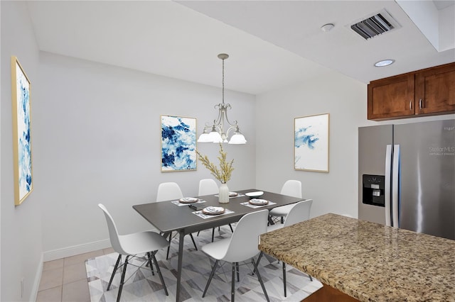 14041 Bellagio Way Unit 214, Osprey, FL 34229 - dining room with baseboards, a chandelier, light tile patterned flooring, and visible vents
