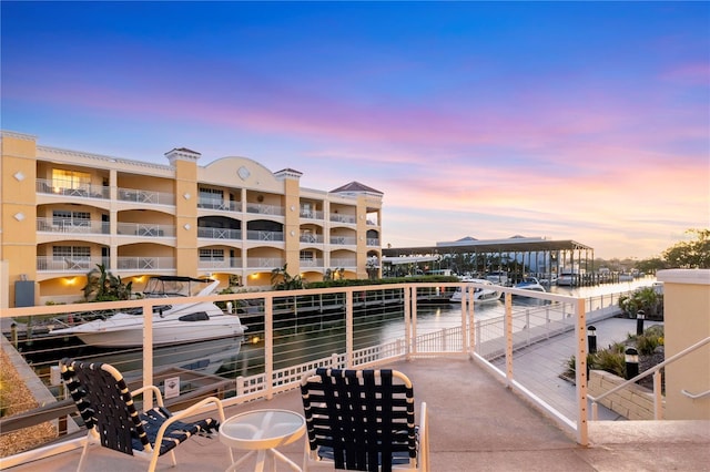 14041 Bellagio Way Unit 214, Osprey, FL 34229 - patio terrace at dusk with a water view