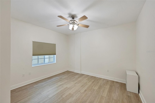 14041 Bellagio Way Unit 214, Osprey, FL 34229 - unfurnished room featuring a ceiling fan, baseboards, and light wood finished floors