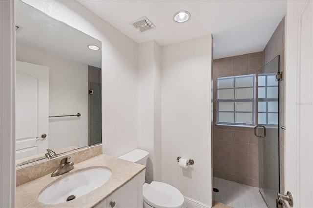 14041 Bellagio Way Unit 214, Osprey, FL 34229 - full bathroom featuring vanity, toilet, recessed lighting, a shower stall, and visible vents