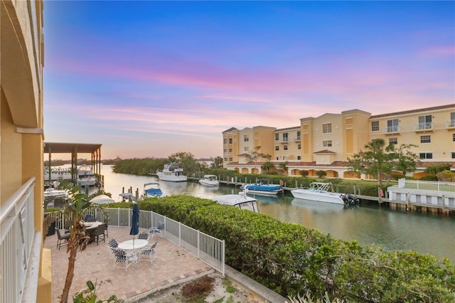 14041 Bellagio Way Unit 214, Osprey, FL 34229 - exterior space featuring a water view and a patio
