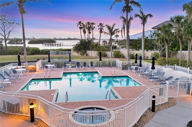 14041 Bellagio Way Unit 214, Osprey, FL 34229 - community pool featuring fence, a water view, and a patio area