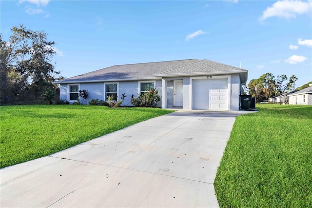 ranch-style house featuring a front lawn and a garage