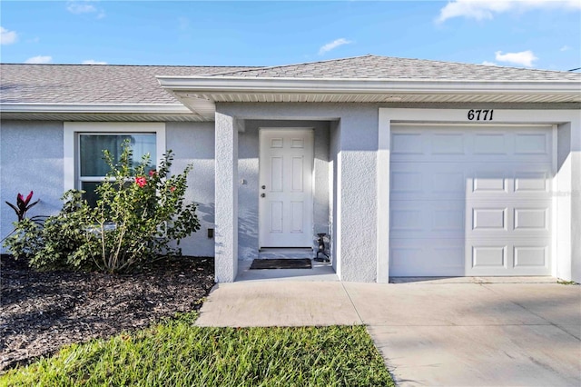 doorway to property featuring a garage