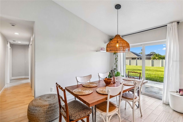 dining area with light hardwood / wood-style flooring