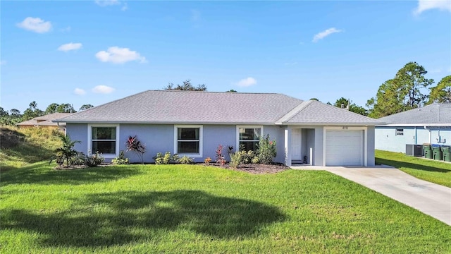 ranch-style house featuring a front lawn, central AC, and a garage