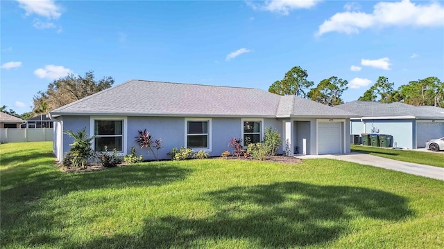 ranch-style house featuring a front yard and a garage