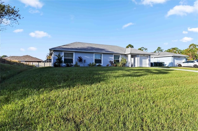 ranch-style home featuring a front yard and a garage