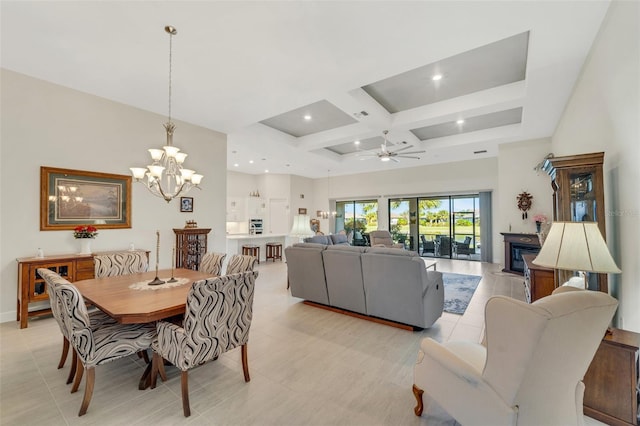 tiled dining space featuring a high ceiling, beamed ceiling, coffered ceiling, and ceiling fan with notable chandelier