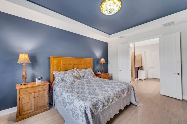 bedroom with light hardwood / wood-style floors