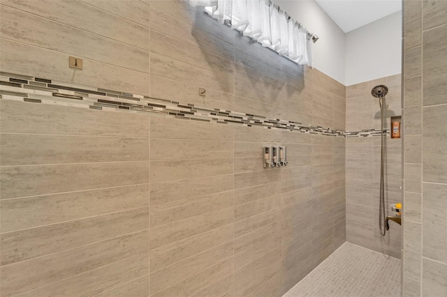 bathroom with tiled shower