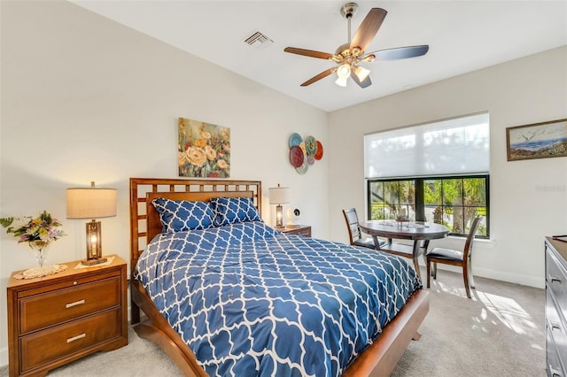 bedroom featuring ceiling fan and light colored carpet