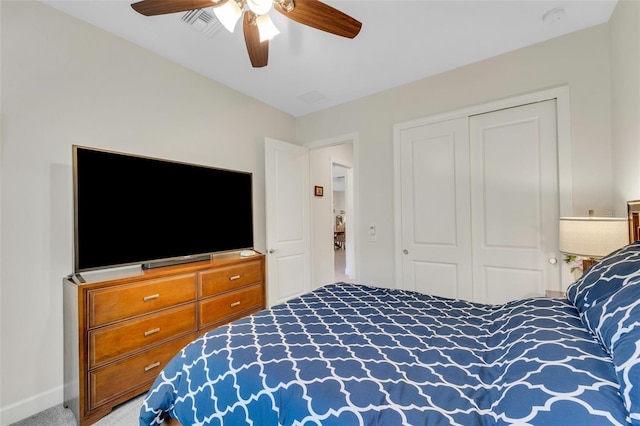 bedroom with carpet, a closet, and ceiling fan