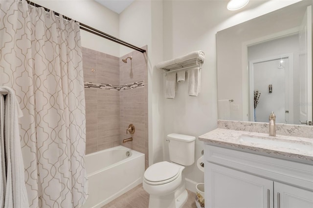 full bathroom with vanity, toilet, and shower / tub combo