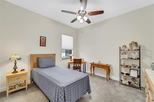 bedroom featuring light colored carpet and ceiling fan