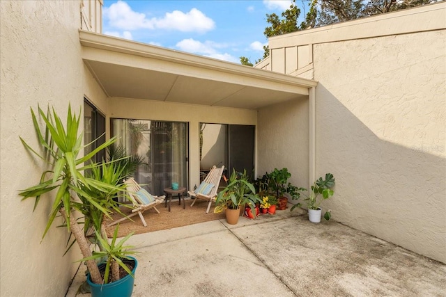 doorway to property featuring a patio