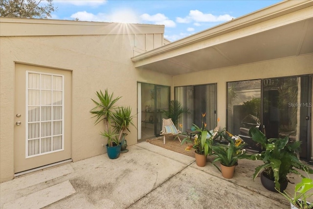 entrance to property featuring a patio area