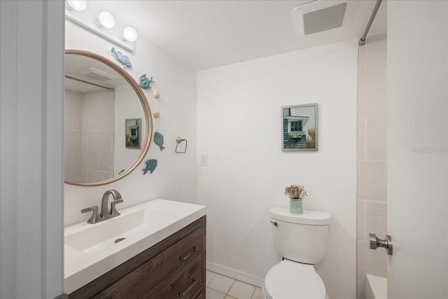 bathroom featuring vanity, toilet, and tile patterned floors