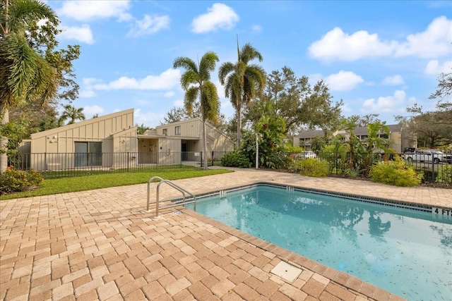 view of swimming pool with a patio area