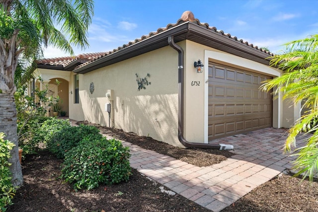 view of property exterior with a garage