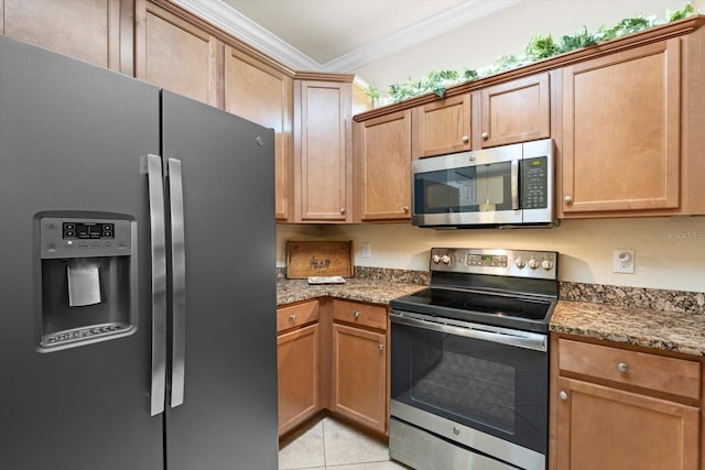 kitchen featuring appliances with stainless steel finishes, light tile patterned floors, ornamental molding, and stone countertops