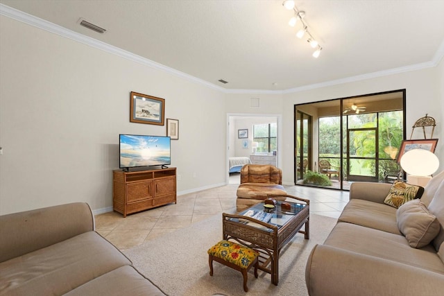 living room with light tile patterned flooring and ornamental molding