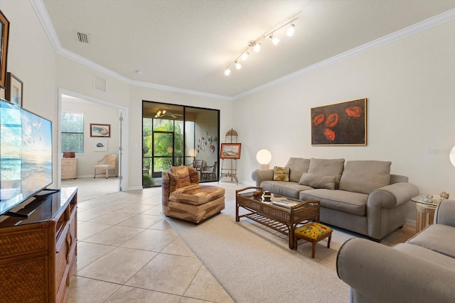 tiled living room featuring a textured ceiling and crown molding