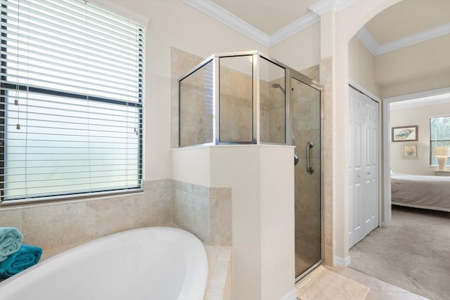 bathroom featuring shower with separate bathtub, tile patterned floors, and plenty of natural light